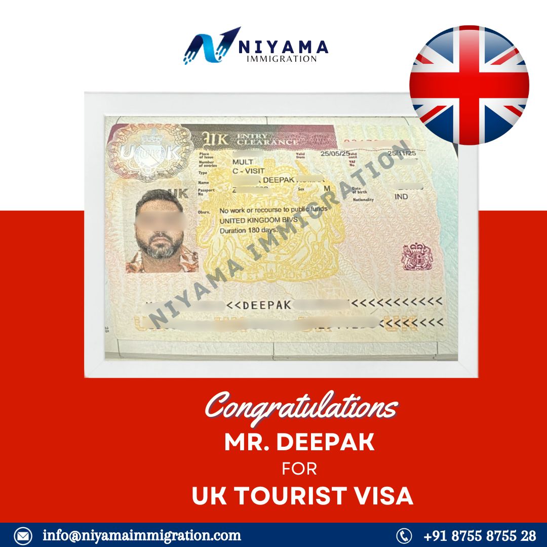 A person holding up an approved visa document