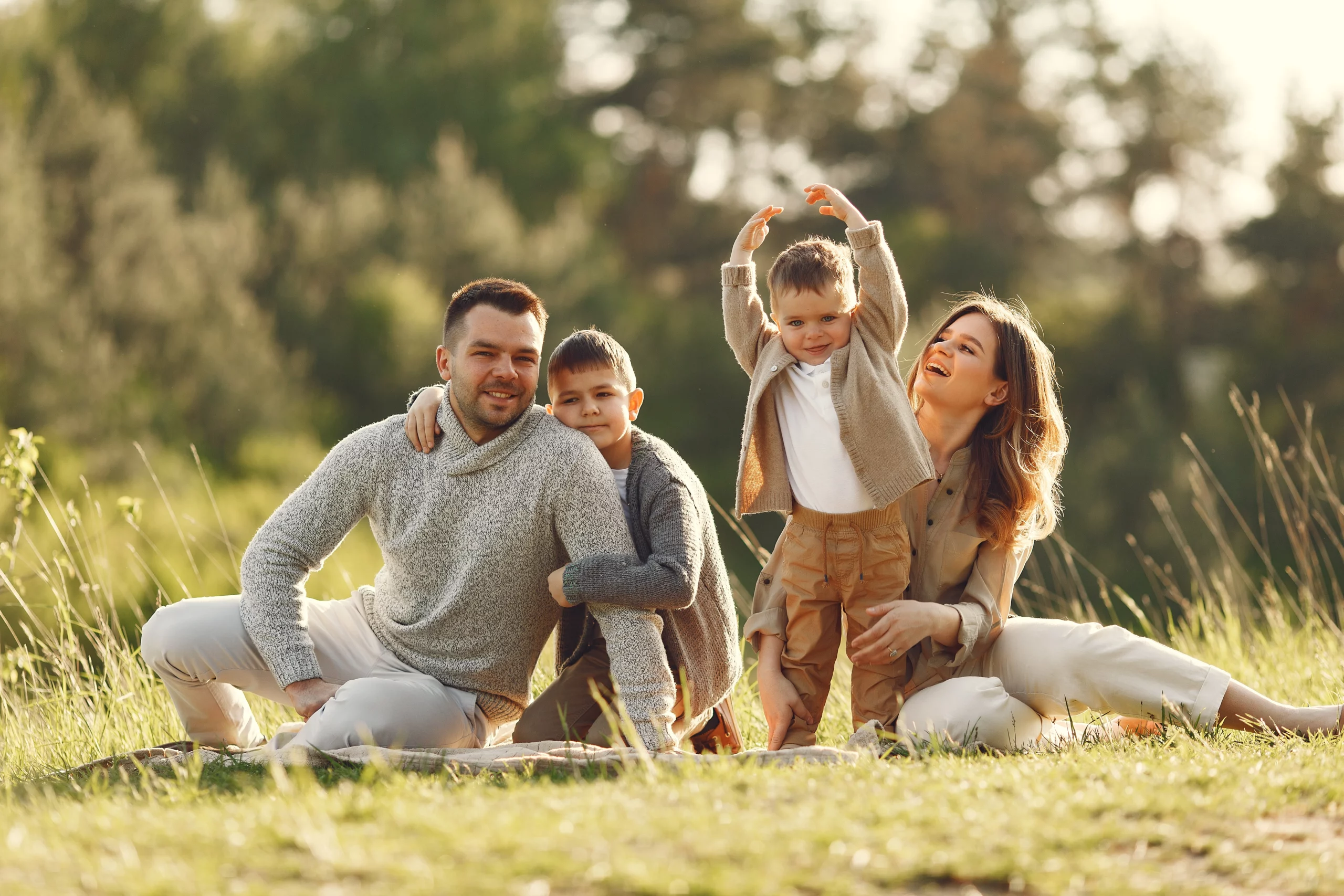 A happy family playing in a field on a sunny day